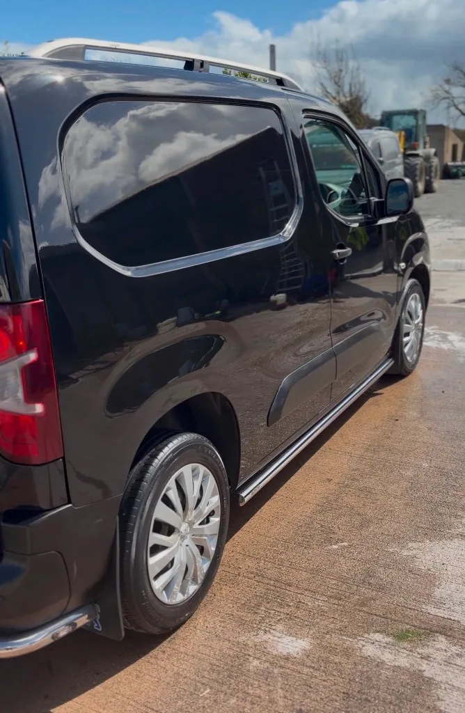 Black passenger van after detailing