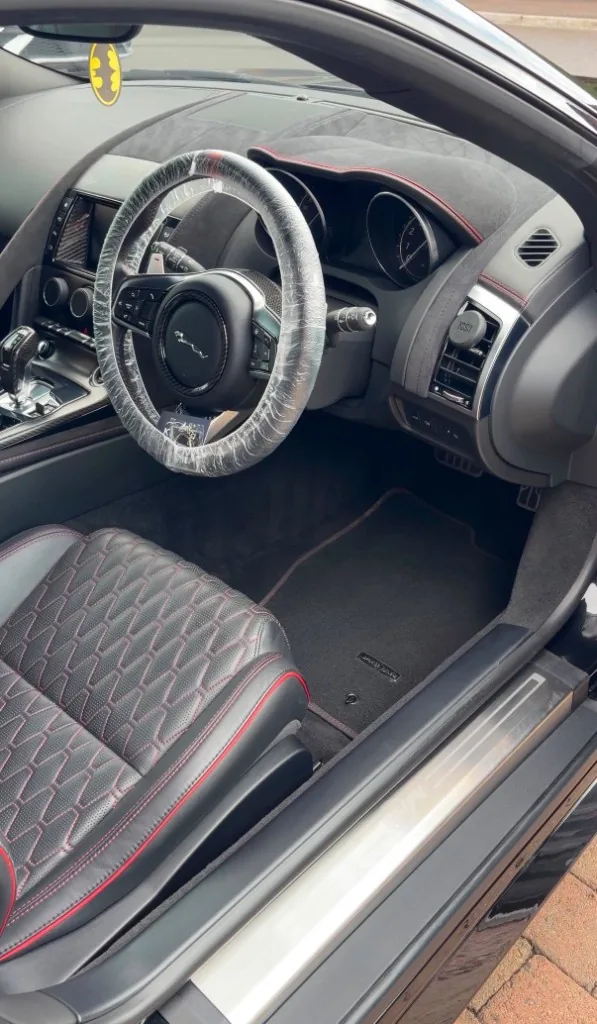 Jaguar interior with red stitching after detailing