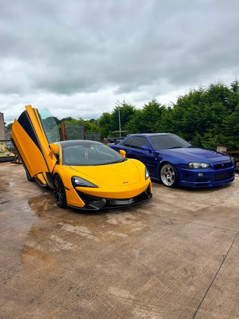 Yellow McLaren and blue Skyline after detailing